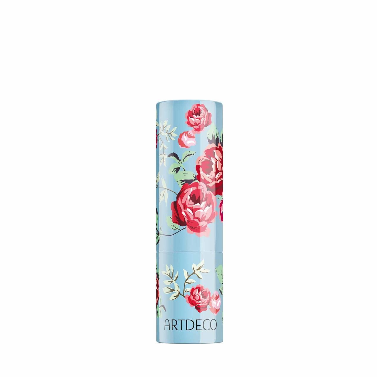 Lippenstift-Hülse mit floralem Muster. Hellblauer Hintergrund mit roten Rosen. Marke ARTDECO.