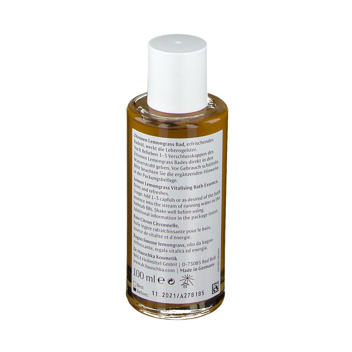 Klarflüssige Flasche mit weißem Deckel. Etikett mit Produktinformationen und rotem Streifen. 100 ml.