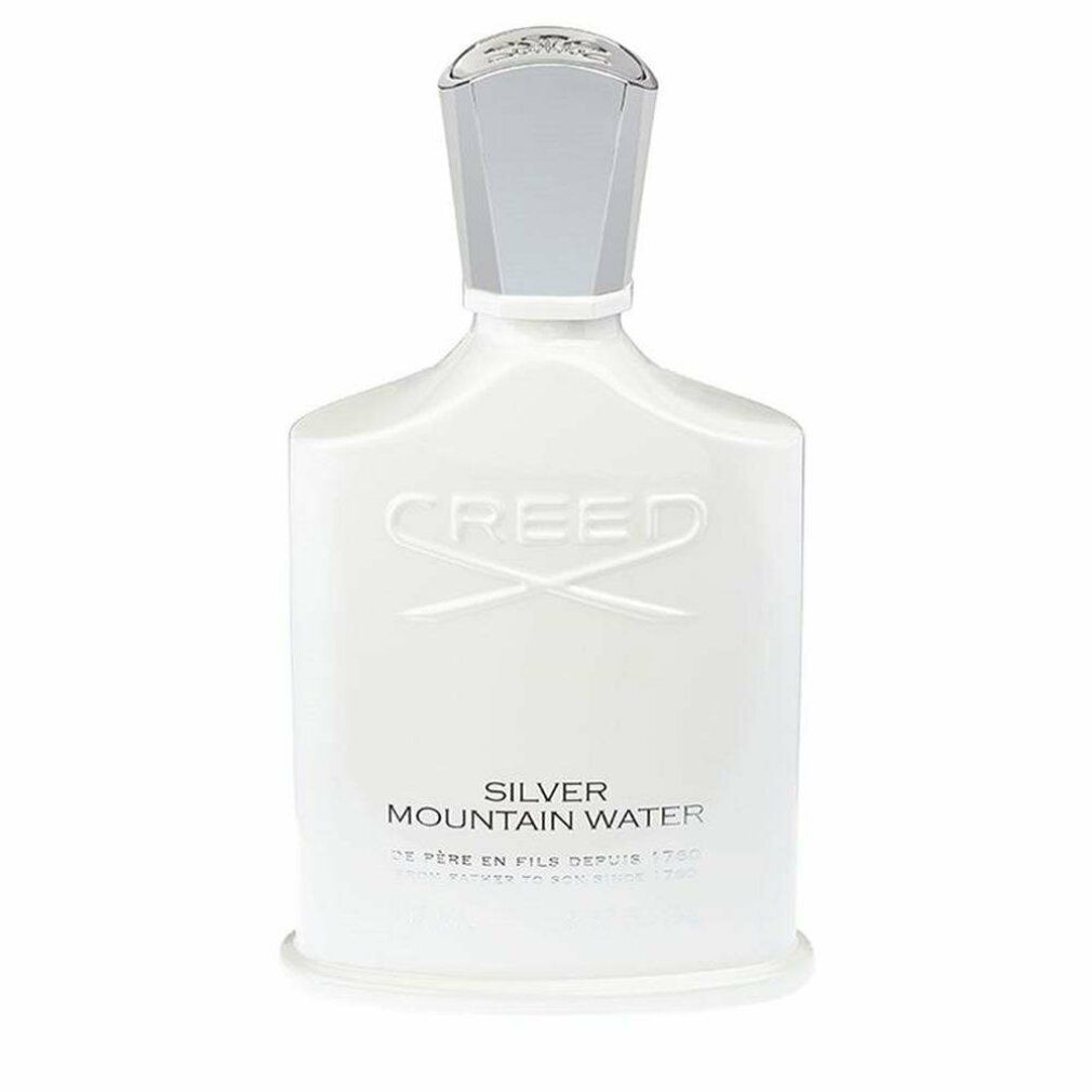 Weiße Parfumflasche. Aufschrift: Creed Silver Mountain Water. Flasche mit silbernem Verschluss.
