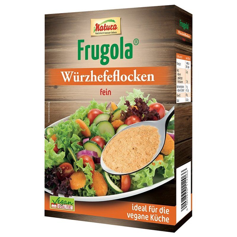 Kartonverpackung mit "Natura Frugola Würzhefeflocken". Aufschrift "fein" und "ideal für die vegane Küche". Vegan-Qualität-Siegel.