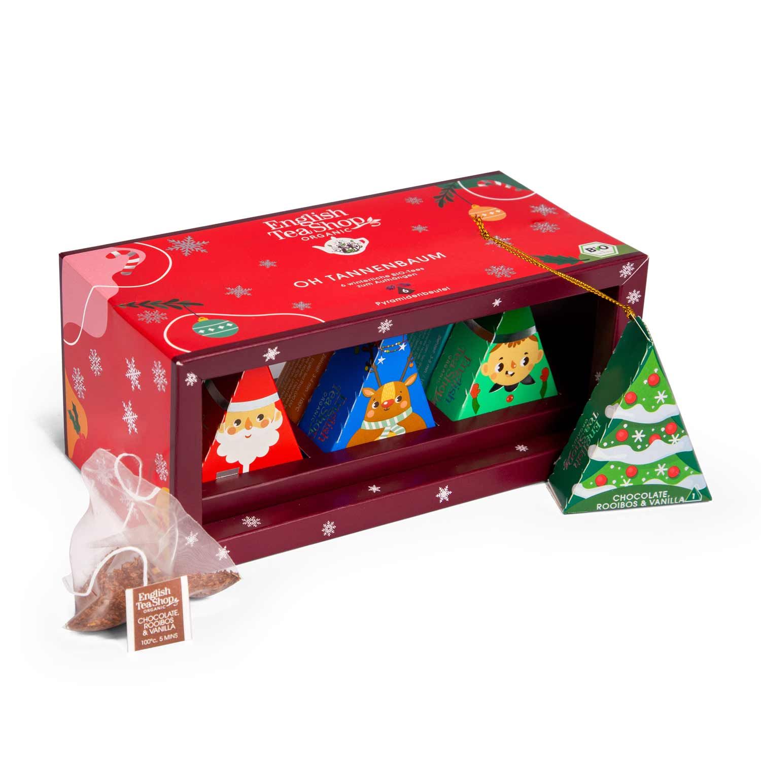 Rote Geschenkbox mit pyramidenförmigen Teebeuteln. Enthält Teebeutel mit weihnachtlichen Motiven. Bio-Zertifizierung.