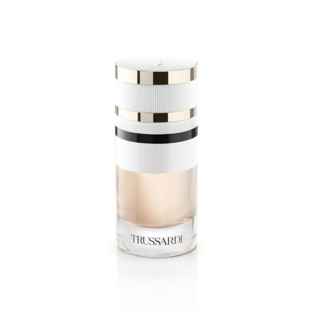 Parfümflakon mit weißem Deckel, goldfarbenen Ringen und Schriftzug Trussardi. Zylindrische Form mit farbigen Streifen.