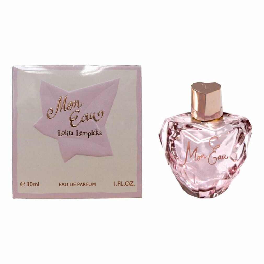 Parfümflakon und Schachtel. Flakon herzförmig, rosa Flüssigkeit, goldener Verschluss. Schachtel mit Schriftzug Mon Eau.
