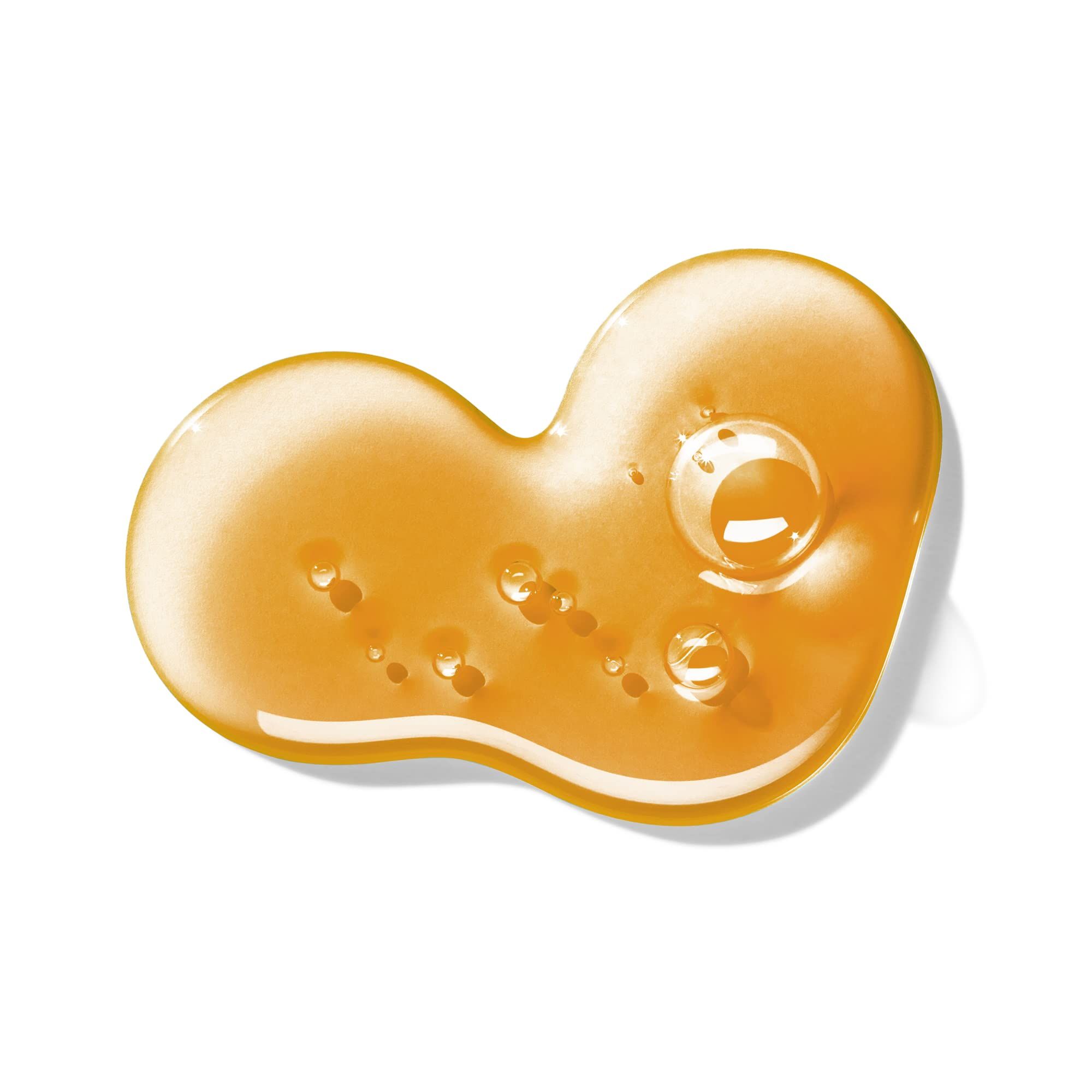 Gelb-oranges Gel mit Blasen auf weißem Hintergrund. Geformt wie eine Doppelherzform.