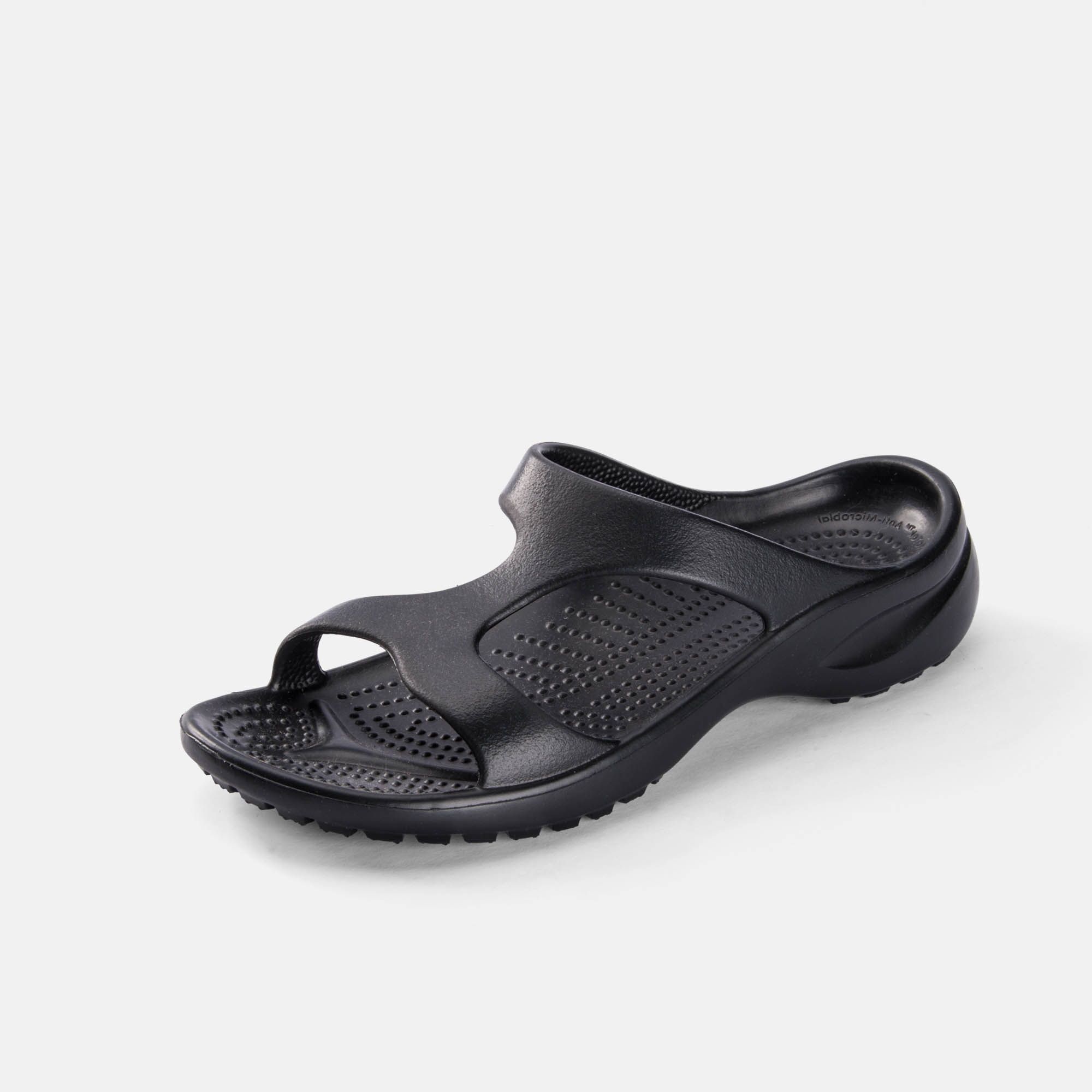 Schwarze Pantolette. Breite Passform. Offene Zehen. Geformte Sohle. Einzelner Schuh.