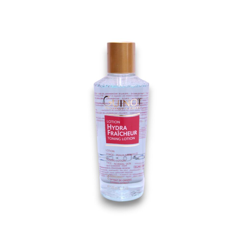 Guinot Lotion Hydra Fraicheur. Flasche mit goldfarbenem Deckel. Rotes Etikett mit Produktbezeichnung. Klare Flüssigkeit sichtbar.