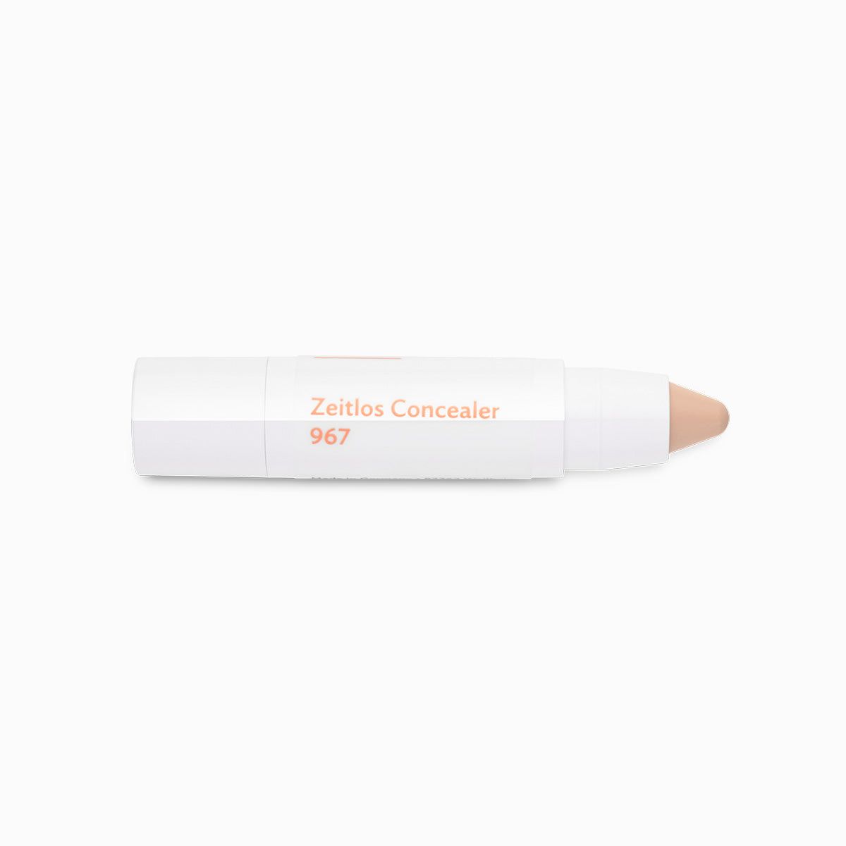 Weißer Concealer-Stift mit abgeschrägter Spitze. Aufschrift: Zeitlos Concealer 967.