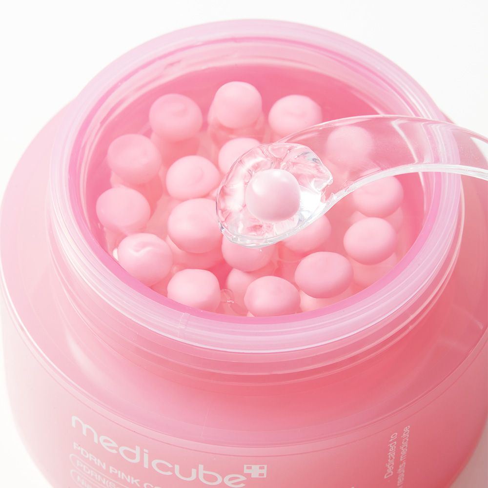 Offener Tiegel der Medicube PDRN Pink Collagen Capsule Cream mit vielen rosa Kapseln in Gel.