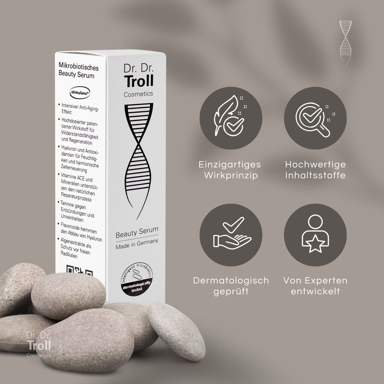 Dr. Dr. Troll Beauty Serum und Verpackung. Weißer Karton mit Produktinformationen und Logos. Steine im Vordergrund.