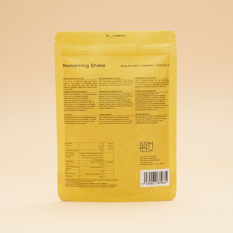 Rückseite einer gelben Verpackung mit Text. Enthält Informationen zu Inhaltsstoffen, Nährwerten und Hersteller. Mit Barcode und "L-COMPLEX" Logo.