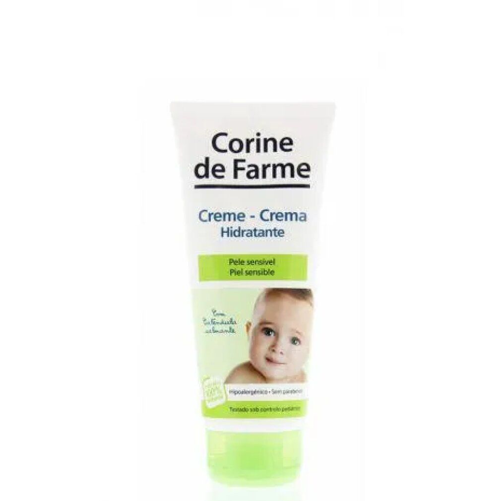 Creme-Tube mit Produktnamen und Babyfoto. Text: Creme-Crema Hidratante, für empfindliche Haut. Grün-weiße Verpackung.