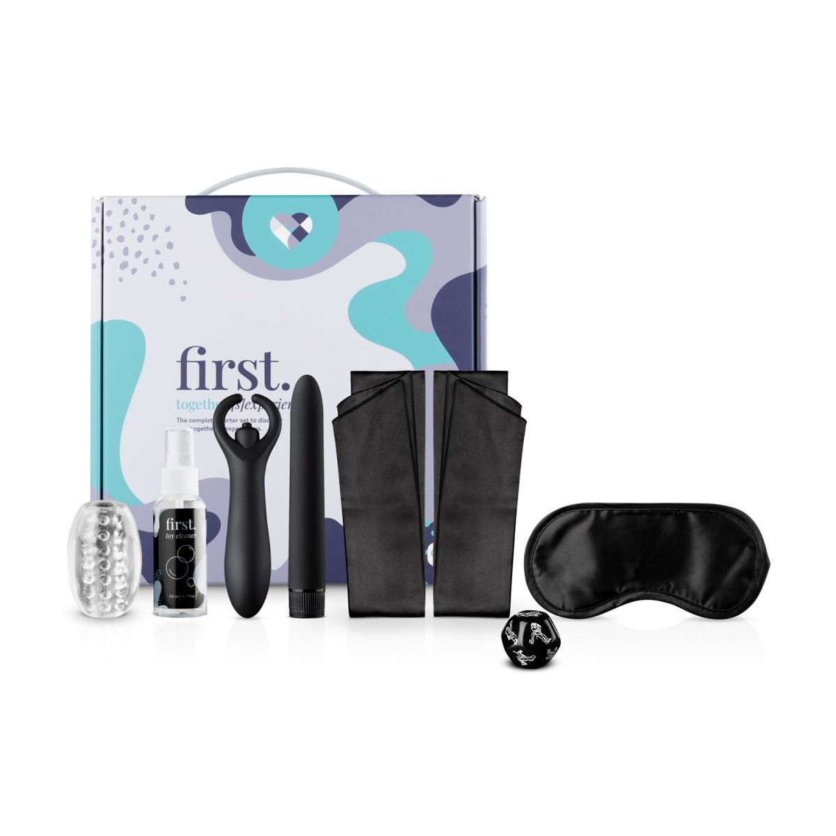 Ein Set mit einem Vibrator, einem Gleitmittel, einem Paar Fesseln, einer Schlafmaske und einem Würfel.