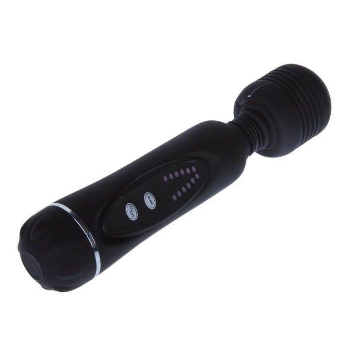 Schwarz Vibrator. Zylindrischer Körper, abgerundeter Kopf. Bedienfeld mit Knöpfen und LEDs. Silberner Ring am Kopf.