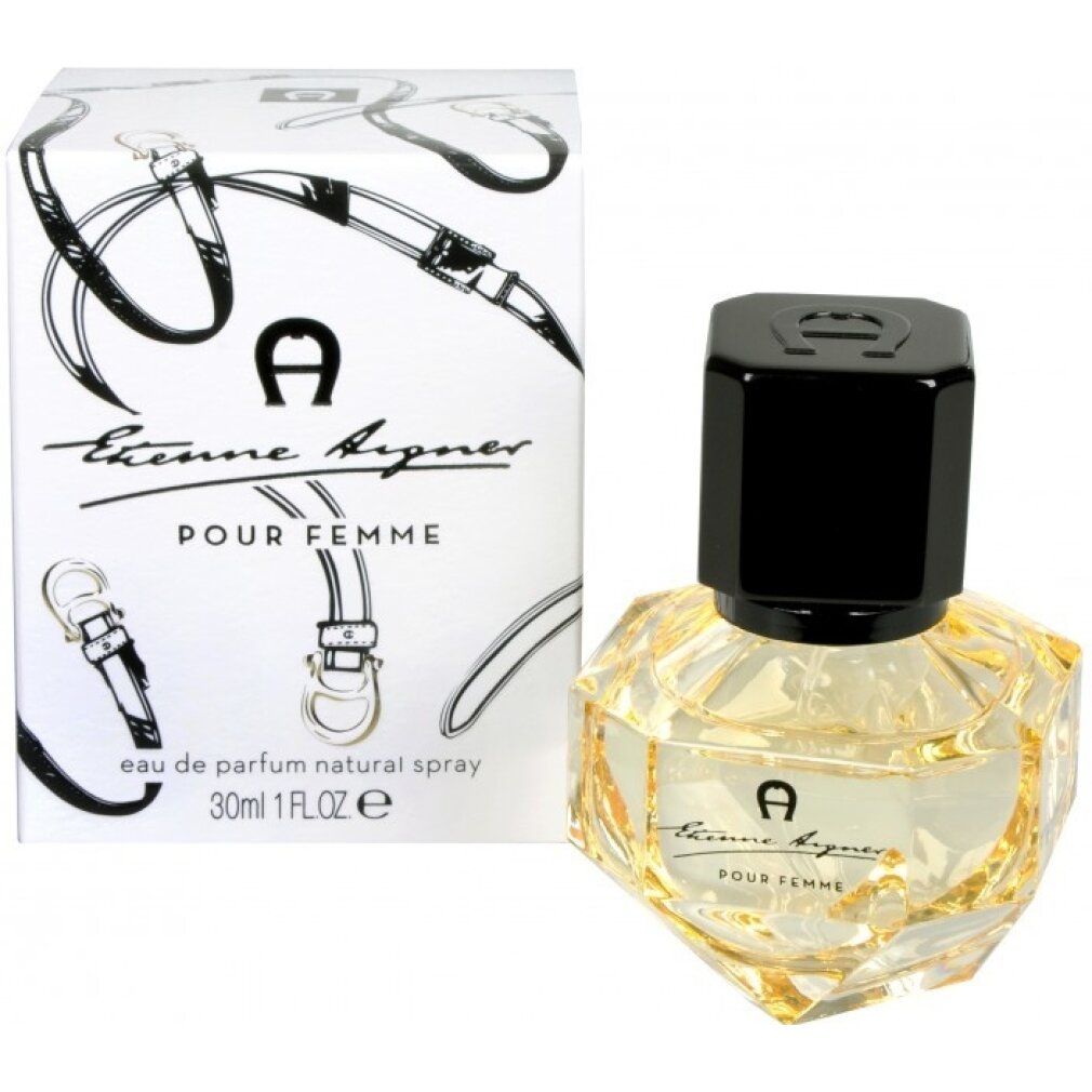 Etienne Aigner Pour Femme EdP. Flakon und Verpackung. Flakon mit schwarzem Deckel, gelber Flüssigkeit. Verpackung mit Logo und Schriftzug.