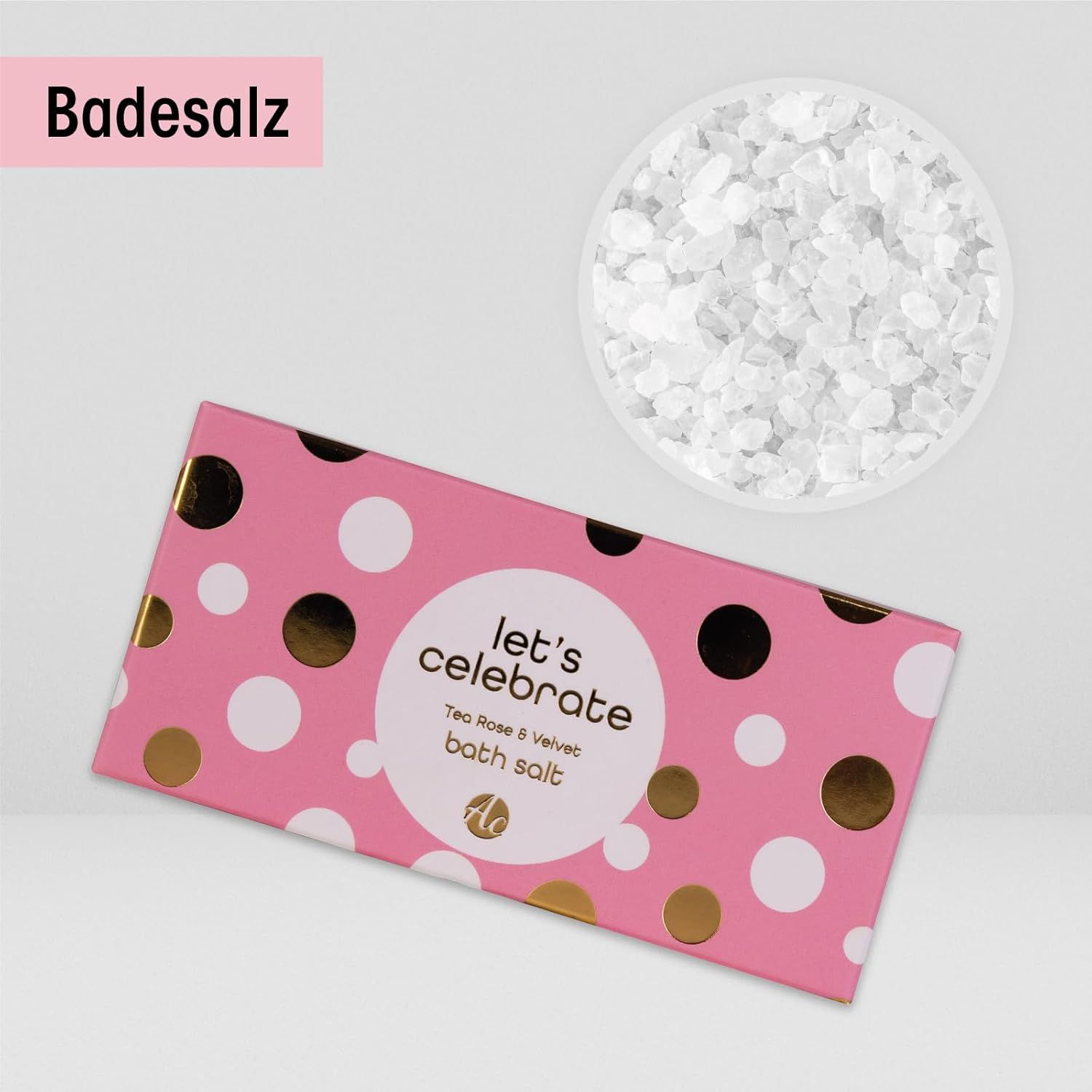 Badesalz in rosa Verpackung mit weißen und goldenen Punkten. Text: Let's Celebrate, Rose & Velvet. Weiße Salzkristalle.