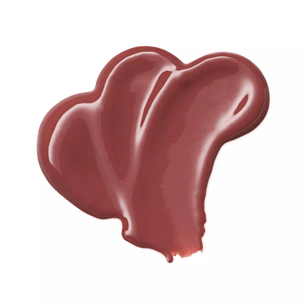 Rosa Lippenstift-Swirl auf weißem Hintergrund. Glänzende Textur.