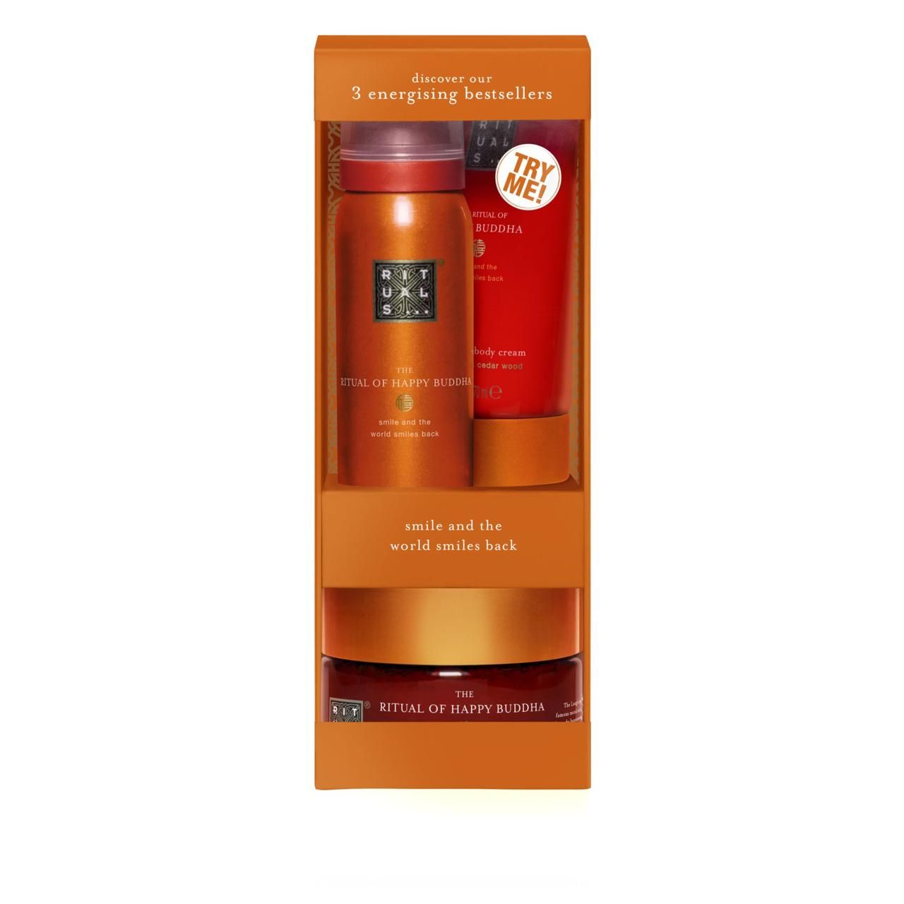 Geschenkset mit drei Produkten. Enthält Duschschaum, Körperpeeling und Körpercreme. Orangefarbene Verpackung mit Produktnamen.