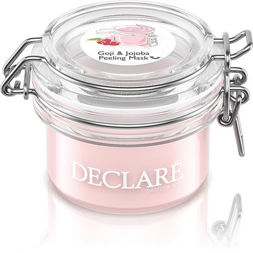 Glasbehälter mit rosa Inhalt und Deckel. Aufschrift DECLARE und Goji & Jojoba Peeling Mask.