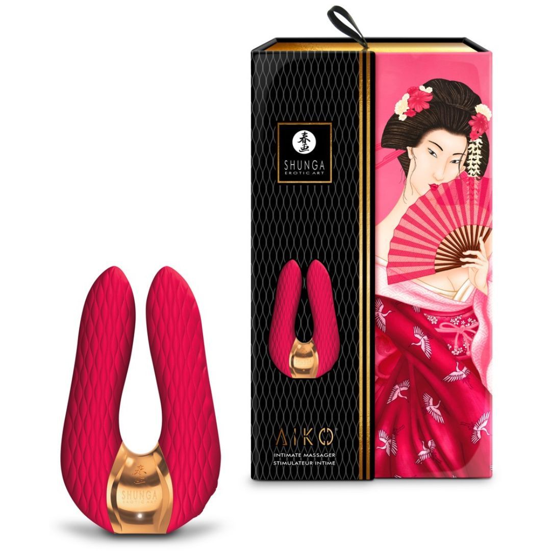 Doppelvibrator und Verpackung. Vibrator rot, goldfarbenes Element. Verpackung mit Geisha-Illustration und Marke SHUNGA.