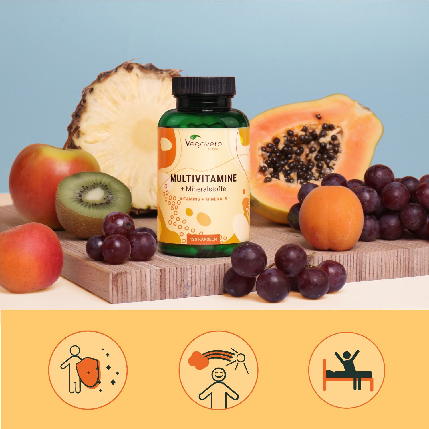 Flasche Vegavaro Multivitamine + Mineralstoffe, umgeben von Obst: Apfel, Kiwi, Trauben, Papaya, Ananas.