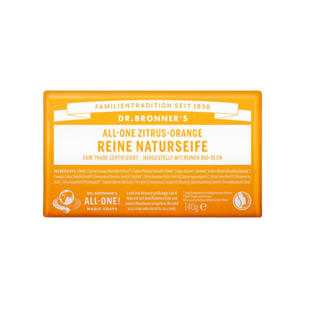 Rechteckige Seife, orangefarben. Aufschrift: DR. BRONNER'S, ALL-ONE ZITRUS-ORANGE, REINE NATURSEIFE. Fair Trade zertifiziert. 140g e.