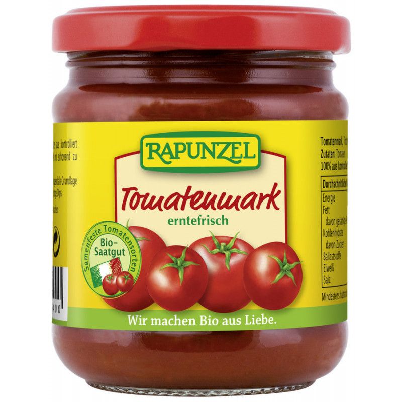 Glas mit Tomatenmark, roter Deckel. Aufschrift: RAPUNZEL Tomatenmark erntefrisch. Bio-Siegel. Abbildung von Tomaten.