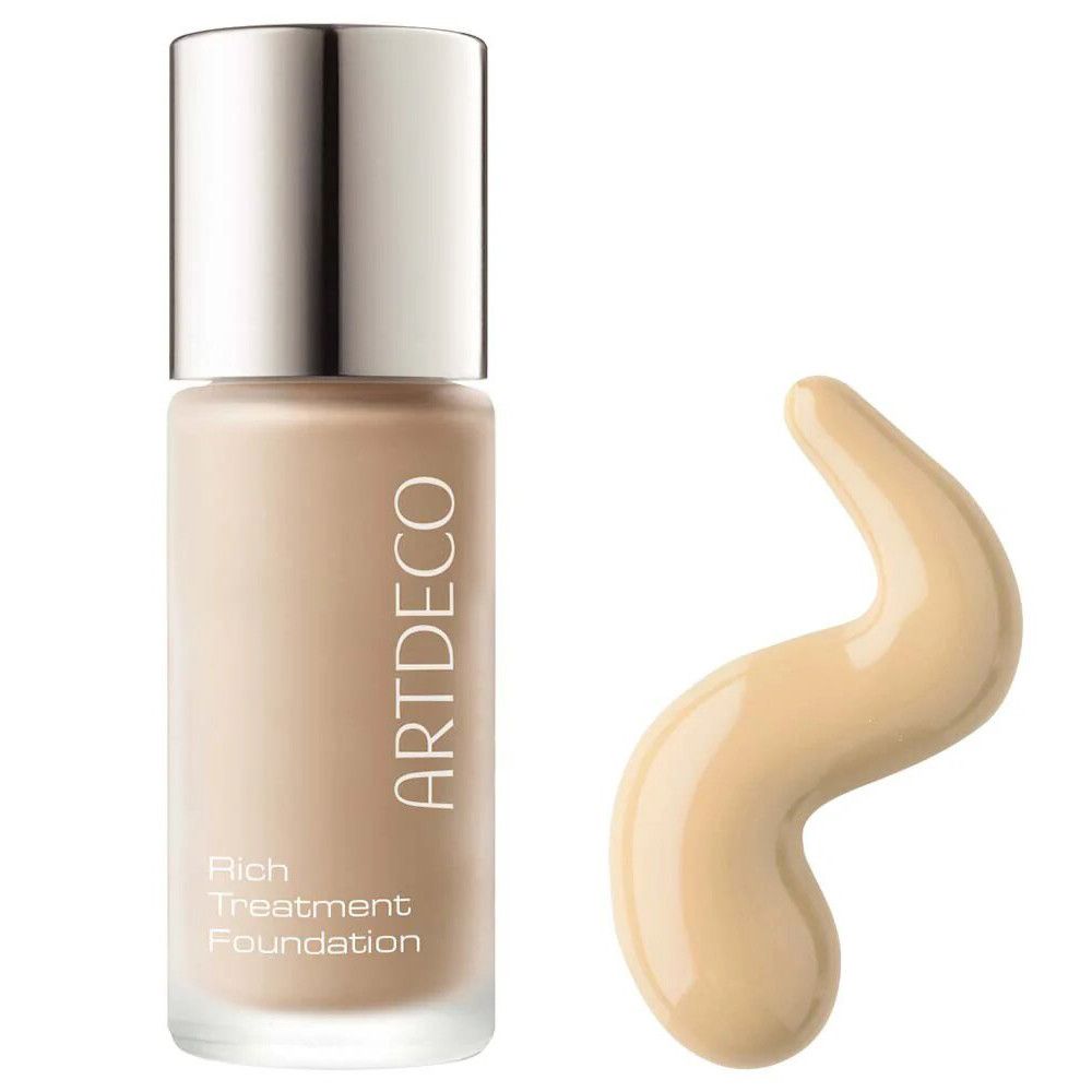 Artdeco Rich Treatment Foundation. Flasche mit silbernem Deckel und Produkt daneben. Produkt in Wellenform.