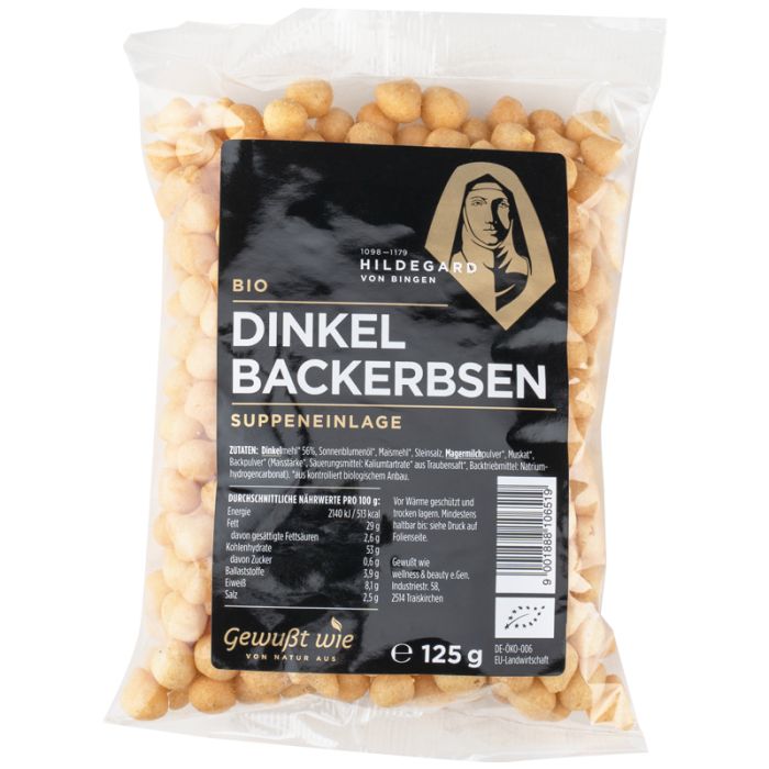 Klare Plastiktüte mit Dinkel Backerbsen. Schwarzes Etikett mit "Hildegard von Bingen" Logo und Produktbezeichnung. Bio-Zertifizierung.