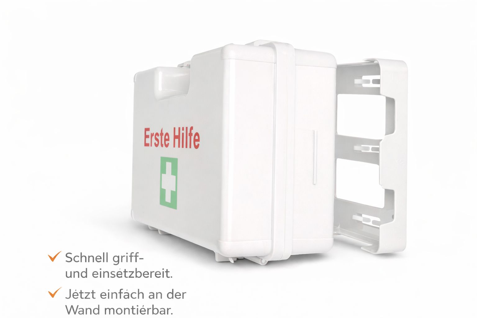 Weißer Erste-Hilfe-Koffer mit roter Aufschrift und grünem Kreuz. Wandhalterung.
