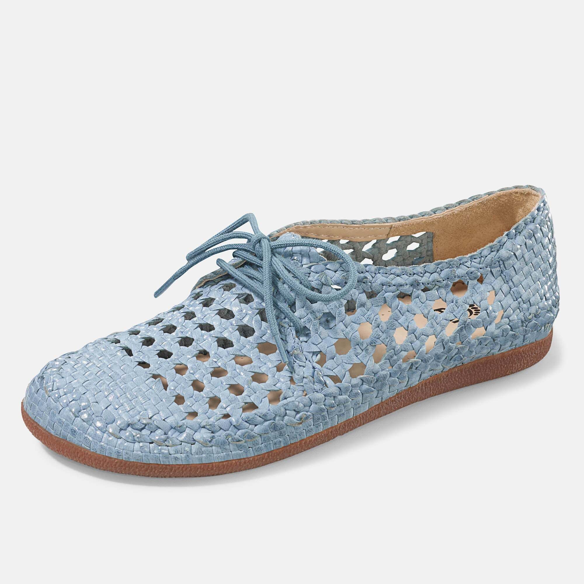 Detailansicht: Innenfutter und geflochtenes Obermaterial eines blauen Schuhs.