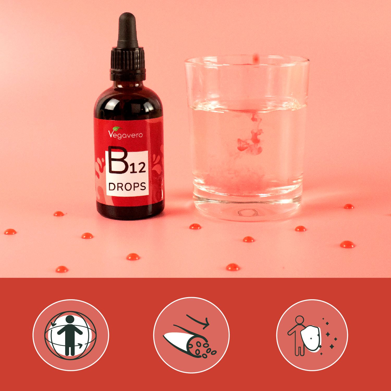 Braune Flasche mit Tropfer und Tropfen in einem Glas Wasser. Marke: Vegavero. B12 Tropfen.