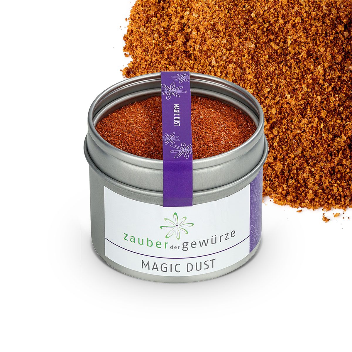 Geöffnete Dose Zauber der Gewürze Magic Dust. Lila Band mit Schriftzug. Gewürzmischung daneben.