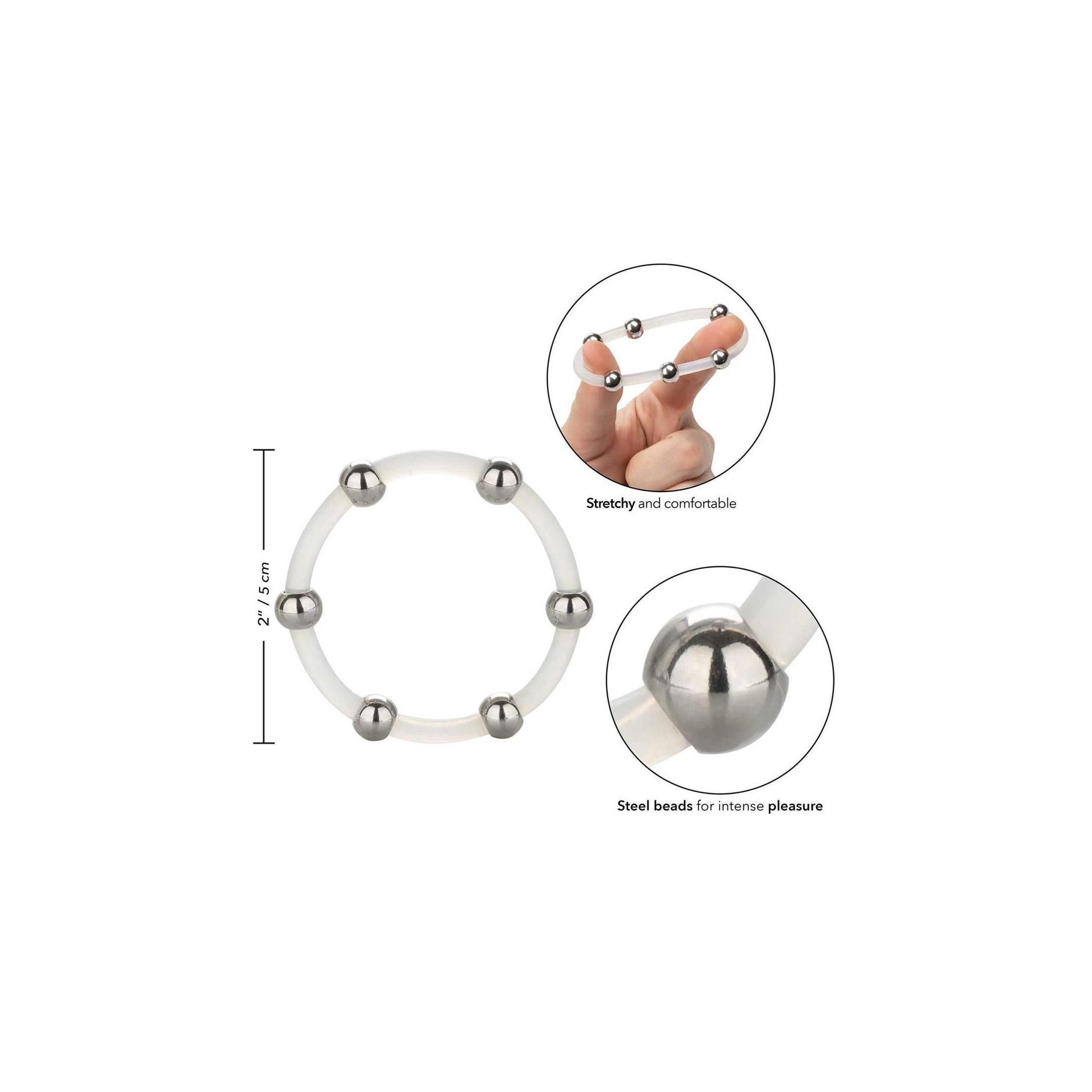 Ring aus transparentem Silikon mit Metallkugeln. Abgebildet sind auch Hände, die den Ring dehnen, und eine Nahaufnahme.