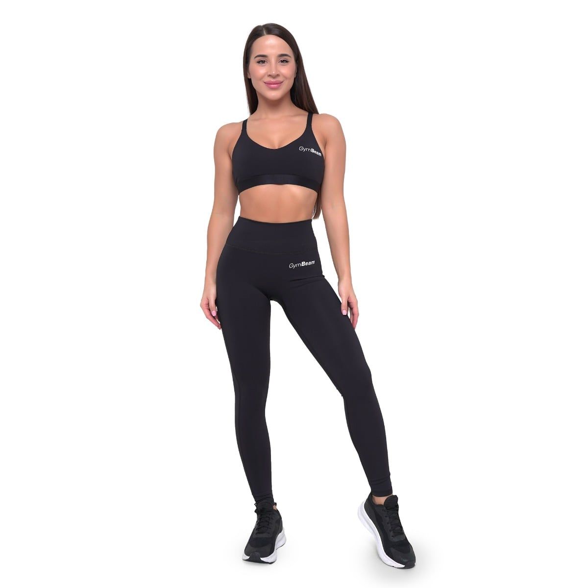 Frau in schwarzem Sport-BH und GymBeam-Leggings mit hohem Bund.