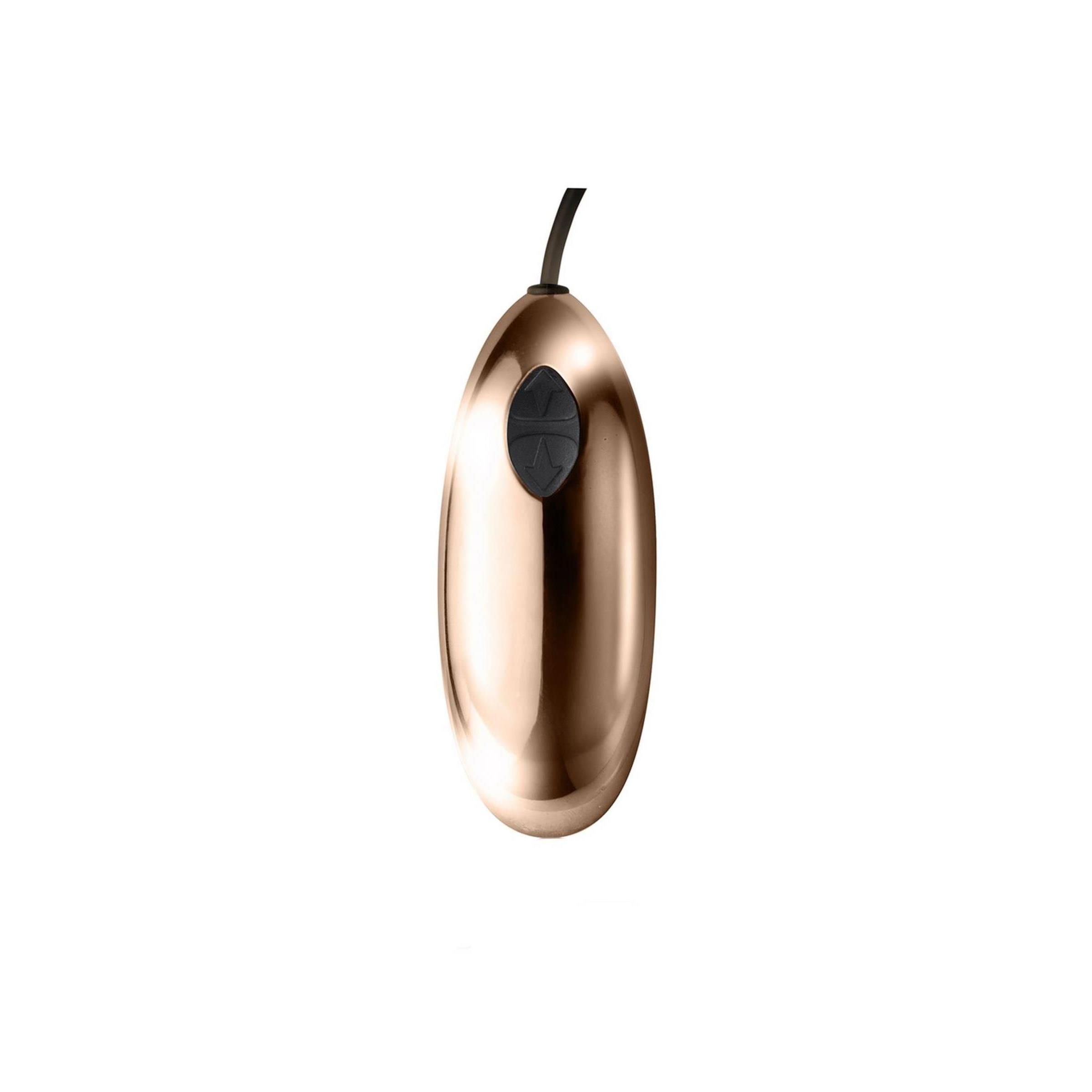 Goldfarbenes, ovales Element mit schwarzem Knopf. Kabelanschluss.