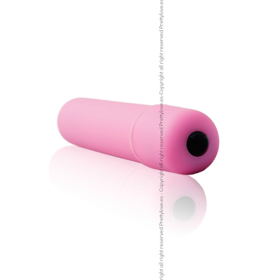 Rosa Mini-Vibrator, zylindrisch, mit schwarzem Knopf an einem Ende. Liegt auf weißem Untergrund.