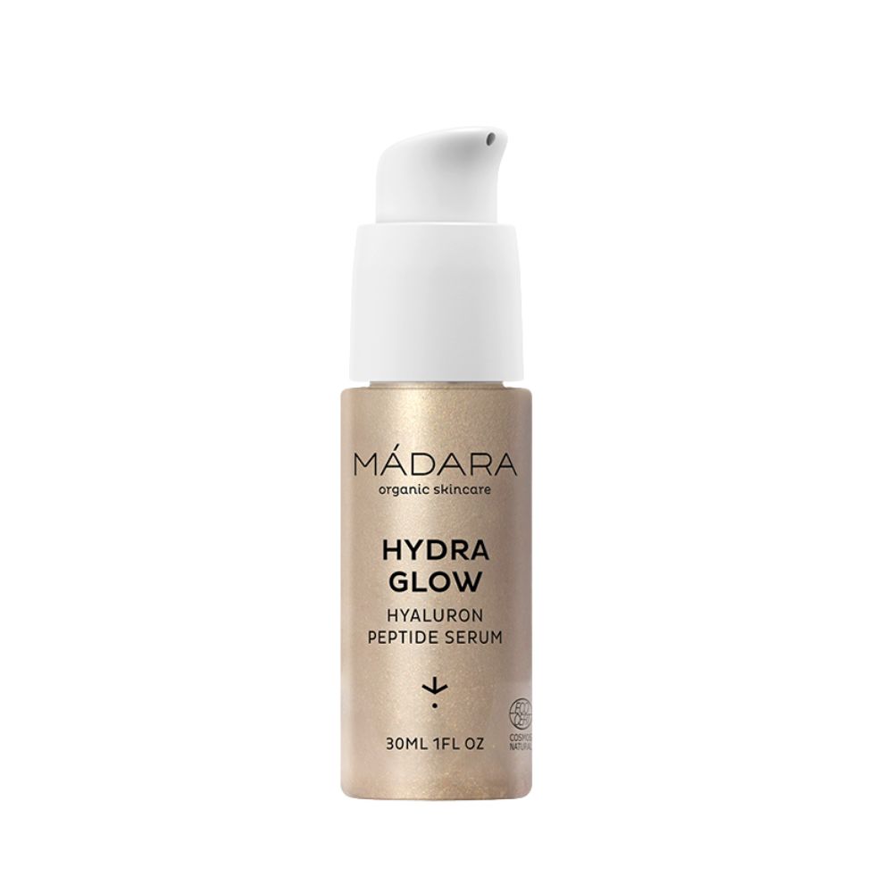 Serumflasche mit weißem Pumpkopf. Aufschrift: MÁDARA, HYDRA GLOW, Hyaluron Peptide Serum. 30ml 1FL OZ.