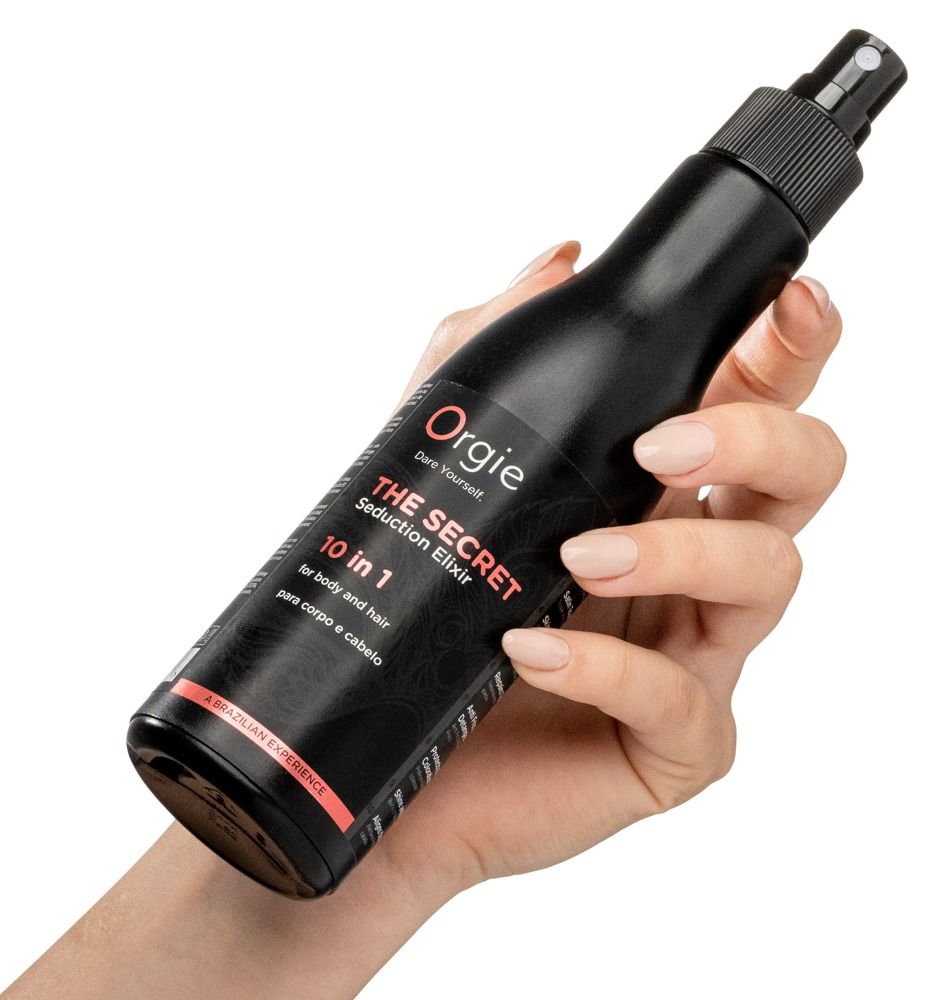 Schwarze Flasche, gehalten in einer Hand. Text: Orgie, The Secret Seduction Elixir, 10 in 1.