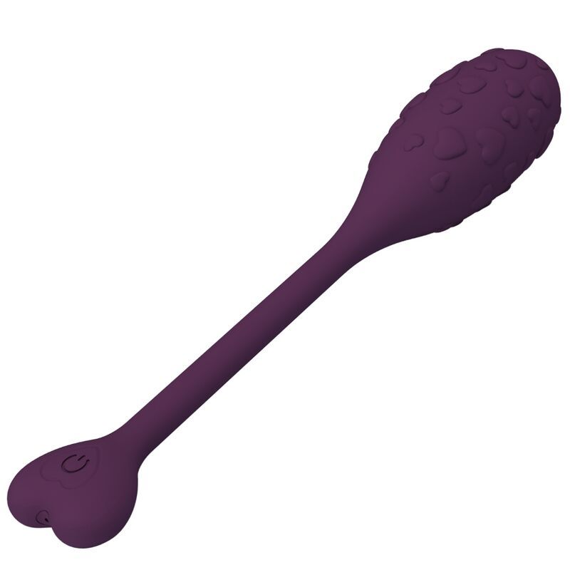 Lila Ei-förmiges Produkt mit Herz-Form am Ende. Oberfläche mit Herz-Mustern. Mit langem Stiel und Herz-förmigem Ende.