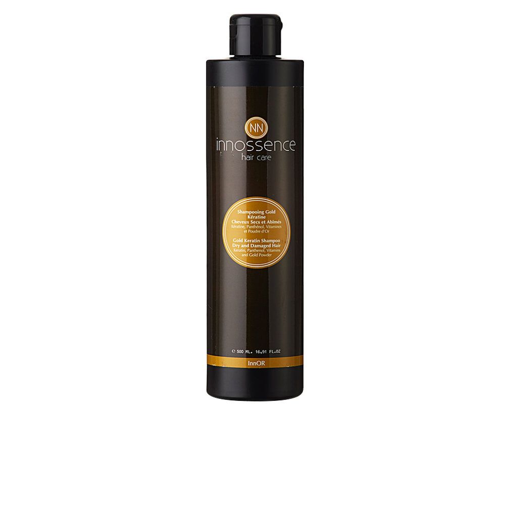 Braune Flasche mit schwarzem Deckel. Etikett mit Produktinformationen und Logo. Gold Keratin Shampoo für trockenes und geschädigtes Haar.