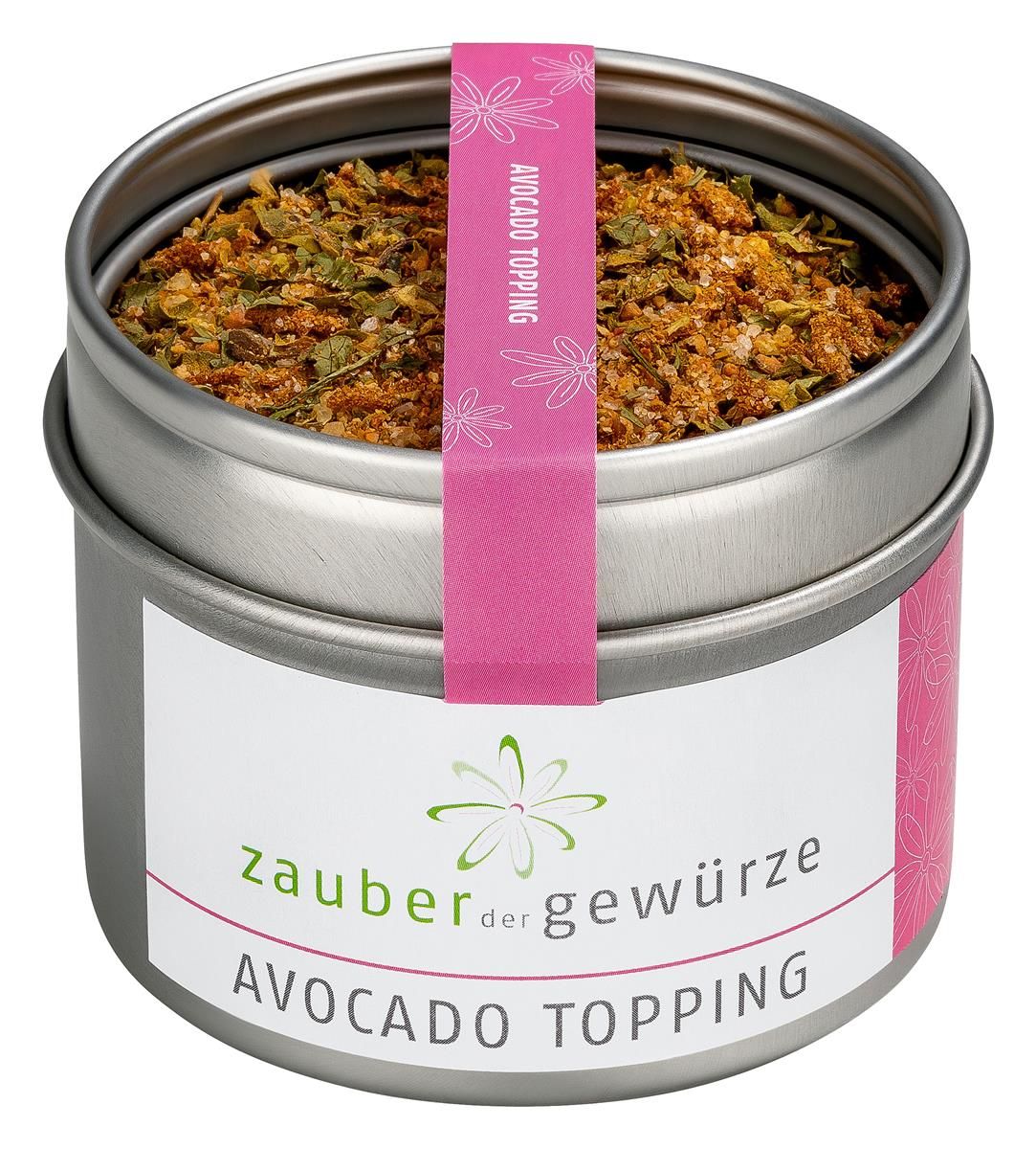 Runde Dose mit Avocado Topping. Rosa Etikett mit Produktnamen und Logo. Deckel mit Aufschrift Avocado Topping.