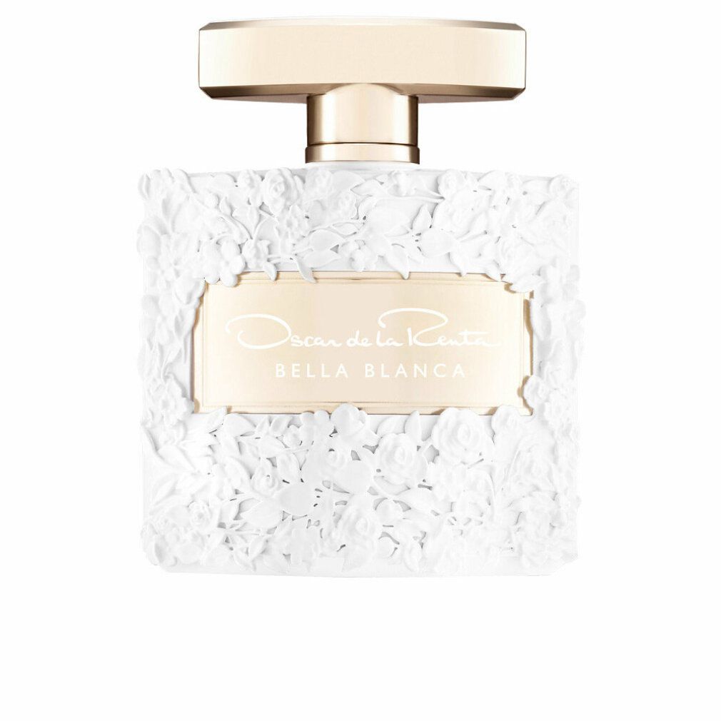 Weißer Parfümflakon mit Blumendekor. Goldfarbener Verschluss. Aufschrift: Oscar de la Renta Bella Blanca.