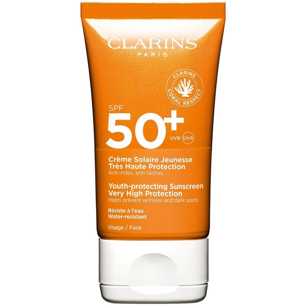 Clarins Sonnencreme LSF 50+ für das Gesicht. Orange Tube mit weißem Verschluss und Korallen-Logo.