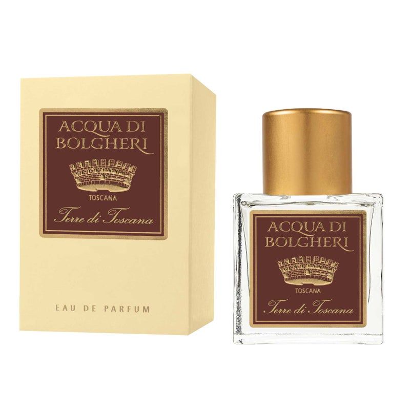 Parfümflakon und Verpackung. Aufschrift: Acqua di Bolgheri Terre di Toscana. Flakon mit goldfarbenem Verschluss. Rechteckige Verpackung.