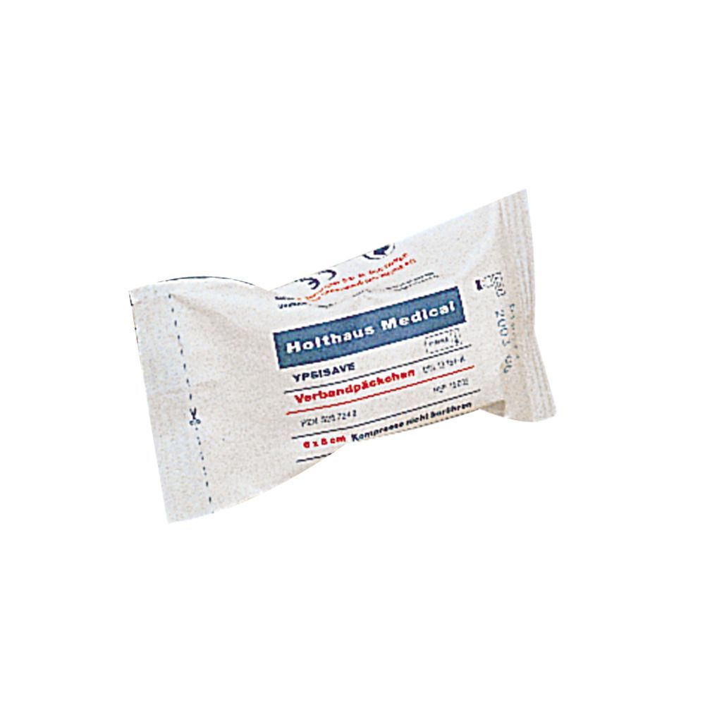 Verbandpäckchen, steril verpackt. Aufschrift: Holthaus Medical YPSISAVE. Größe: 6 x 8 cm. Weiße Verpackung mit blauer und roter Schrift.