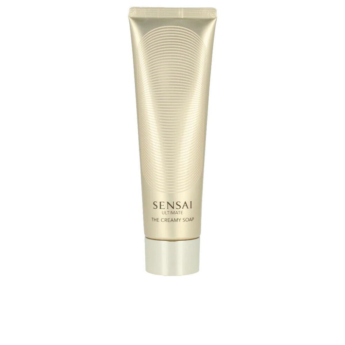 Beige Tube mit goldfarbenem Deckel. Aufschrift: Sensai Ultimate The Creamy Soap.