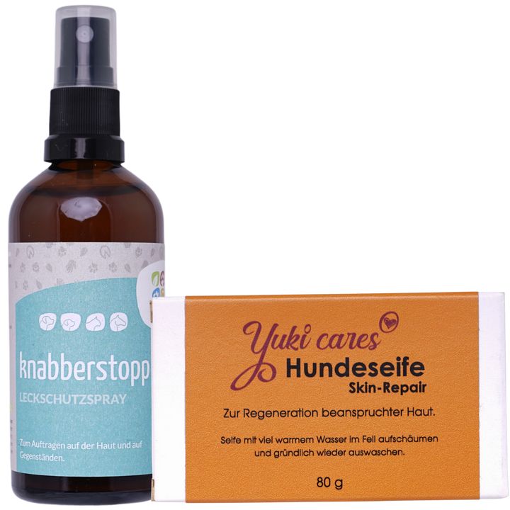 Braune Sprühflasche und rechteckige Seife. Auf der Seife steht "Yuki cares Hundeseife Skin-Repair".