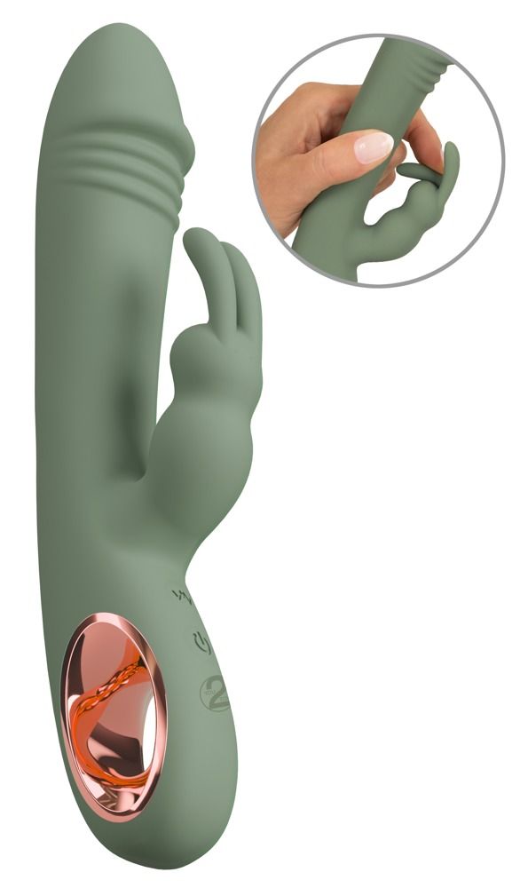 Grüner Vibrator mit Hasenohren und rosegoldfarbenem Akzent. Inset: Hand hält den Vibrator.
