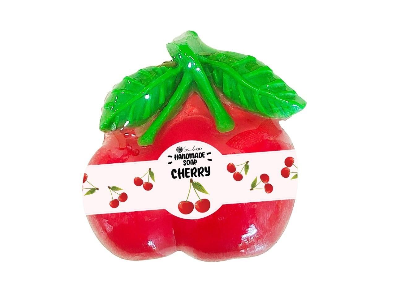 Kirschförmige Seife mit grünen Blättern. Auf einem weißen Band steht "CHERRY".