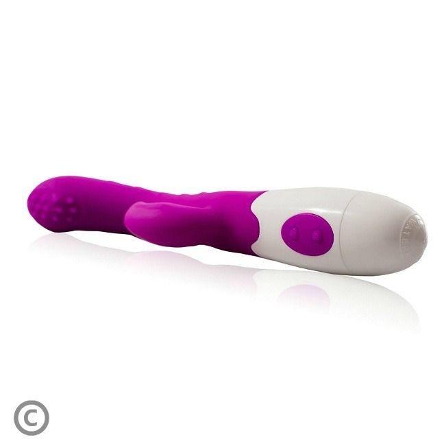 Lila Vibrator mit weißem Griff. Zwei Knöpfe auf dem weißen Teil. Noppen an der Spitze.